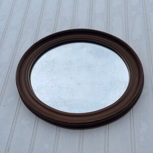 vintage oval wall mirror with naturally aged foxing / cloudy patina